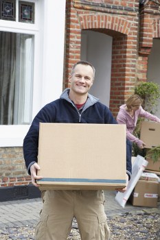 Professional movers handling furniture in Merton