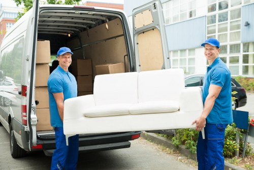 Professional removalists handling moving boxes in Spitalfields