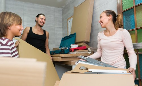 Professional movers assisting with packing at a Whetstone home