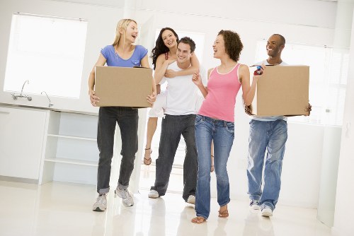 Professional movers handling household items in Woodside