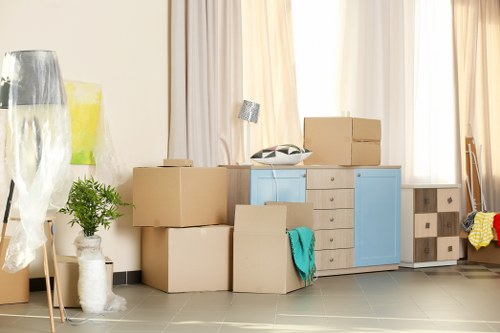 Professional movers packing items in Romford