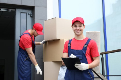 Professional movers assisting with a house removal in Falconwood