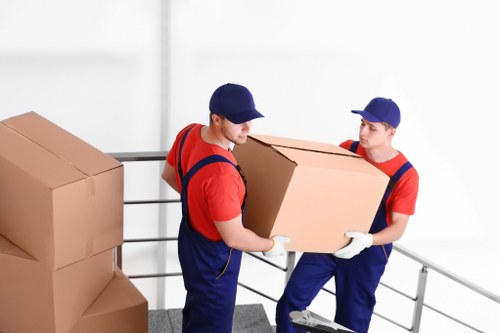 Professional movers assisting in a Cubitt Town house