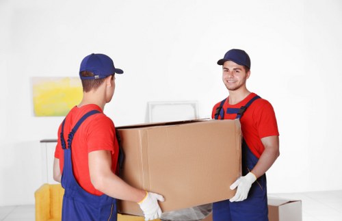 Professional movers handling household items in Havering-atte-Bower