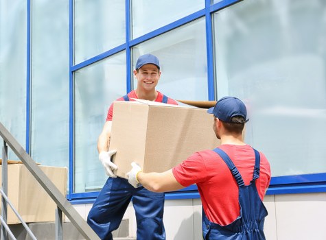 Professional movers handling household items in Forest Gate