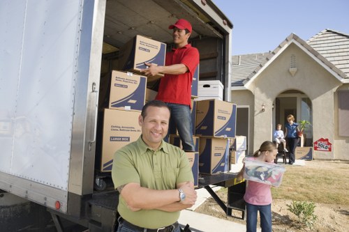 Professional movers handling household items in West Norwood