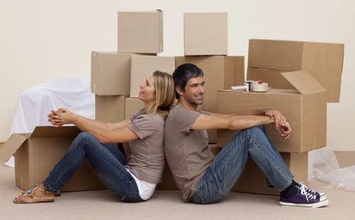 Movers carefully handling household items