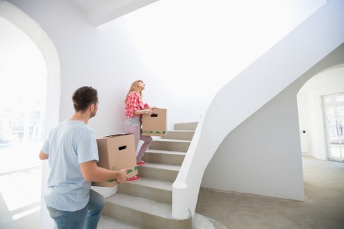 Experienced movers from Toms Removals handling furniture