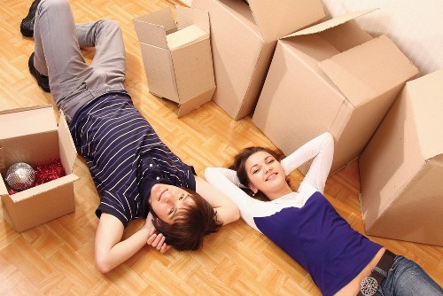 Removal service team loading furniture into a van