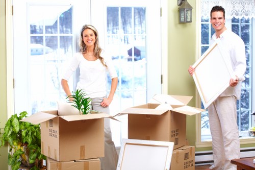 Professional movers handling household items